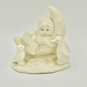 Moonchild Baby in Snowsuit Figurine on Cresent Moon with Penguins